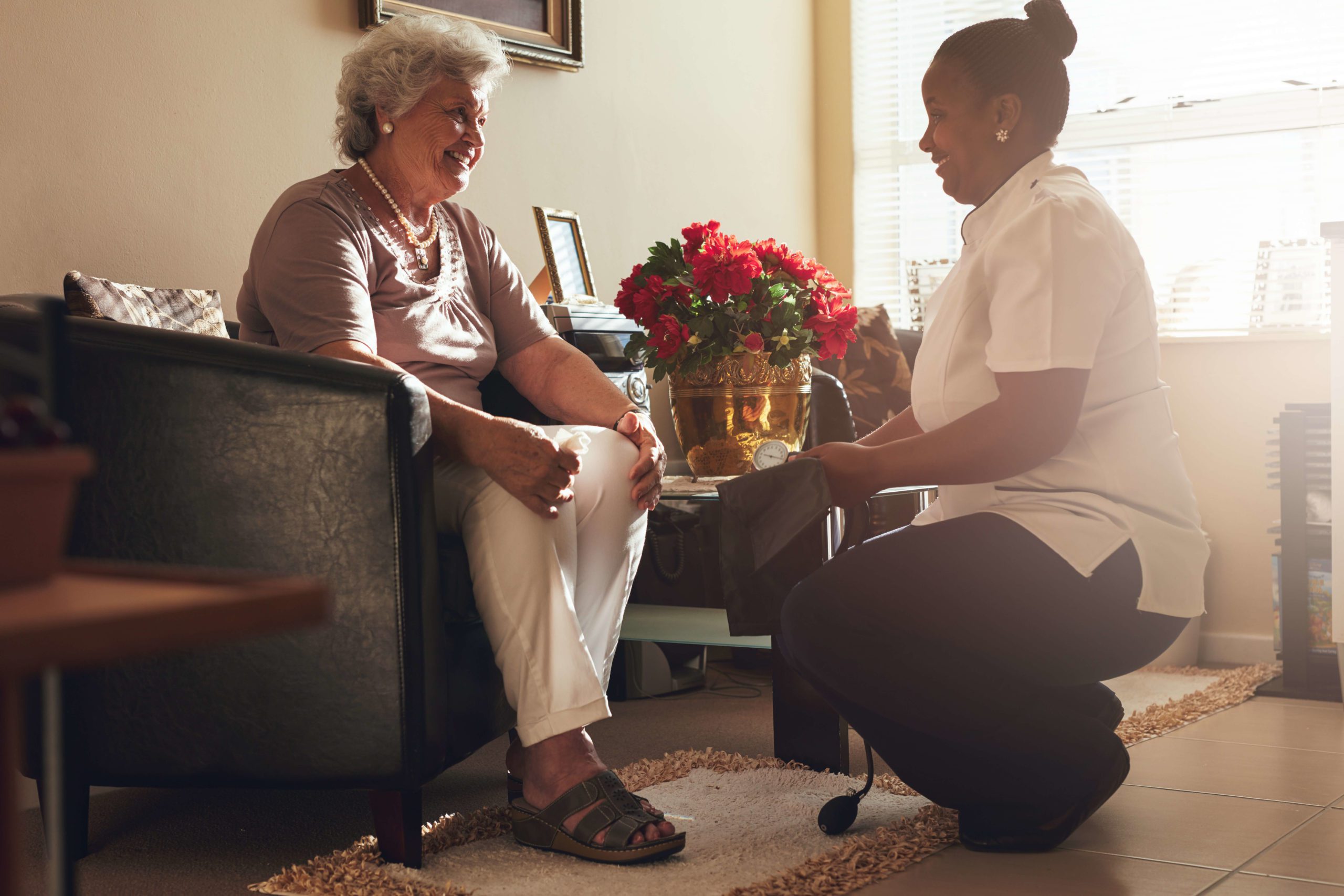 Edinburgh Support Services nurse caring for an elderly lady.